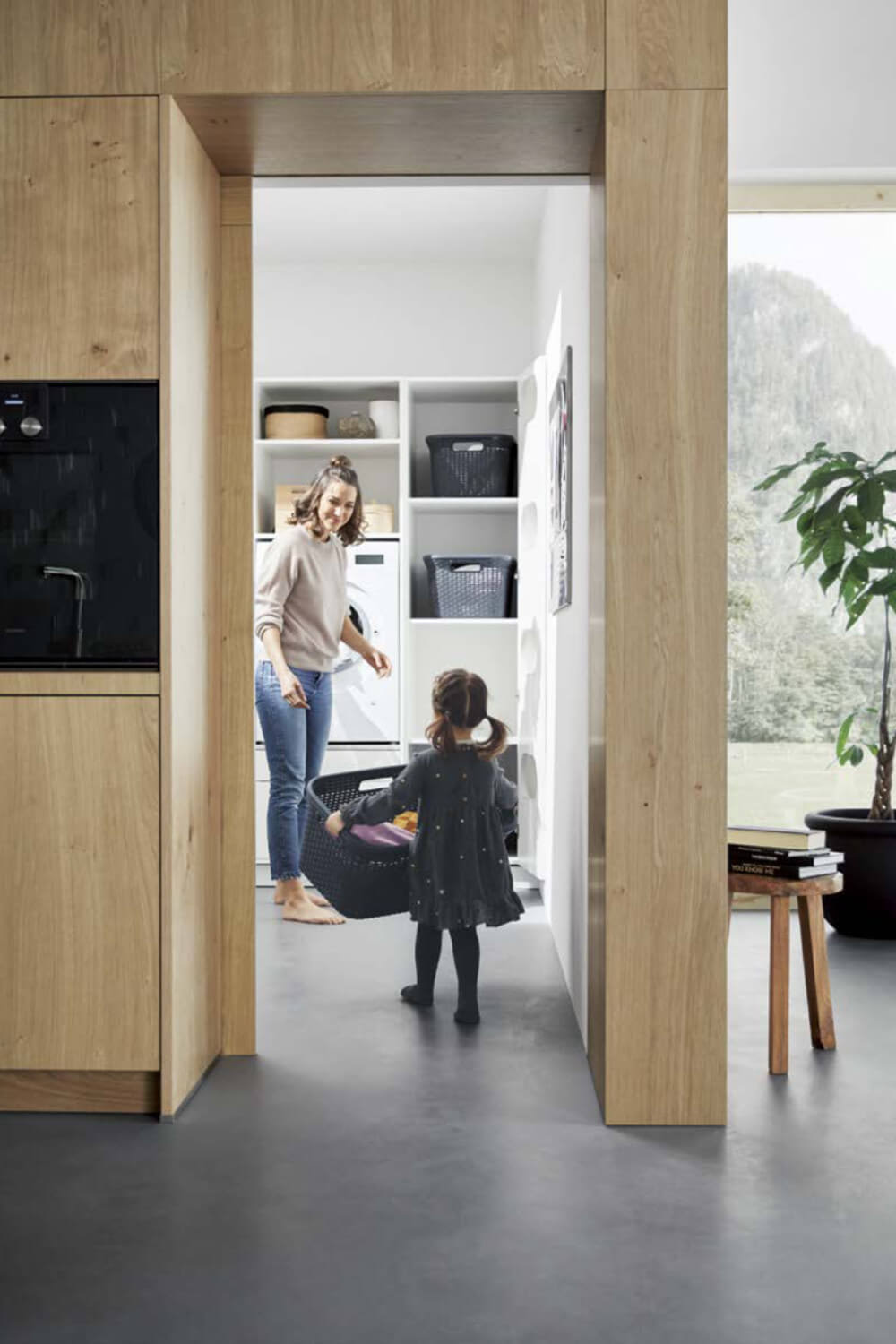 Mother and child in utility room